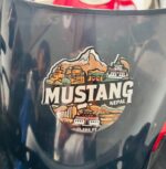 Mustang 13,200 FT sticker showing monasteries, temples, and mountains of Nepal in the bike visor.